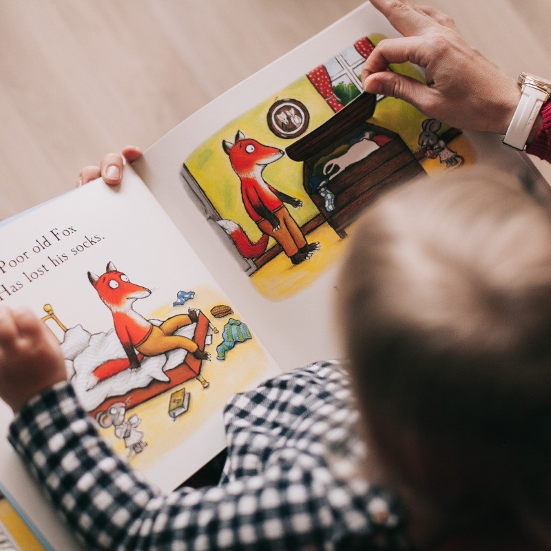 Mum Reading to Son
