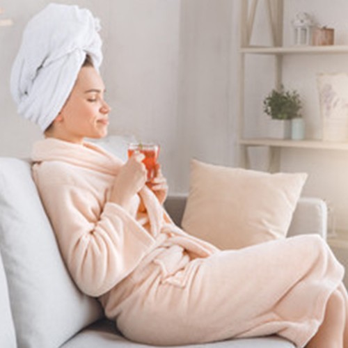 Woman relaxing in bath robe